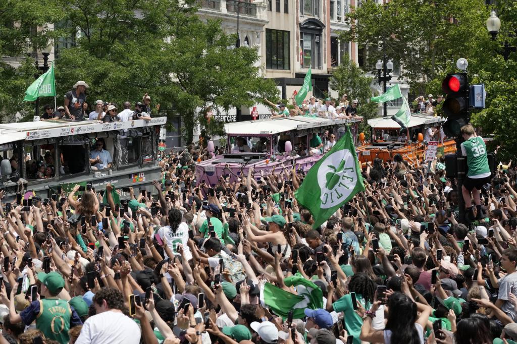 Celtics, celebrating the title of NBA champion on the streets of Boston.