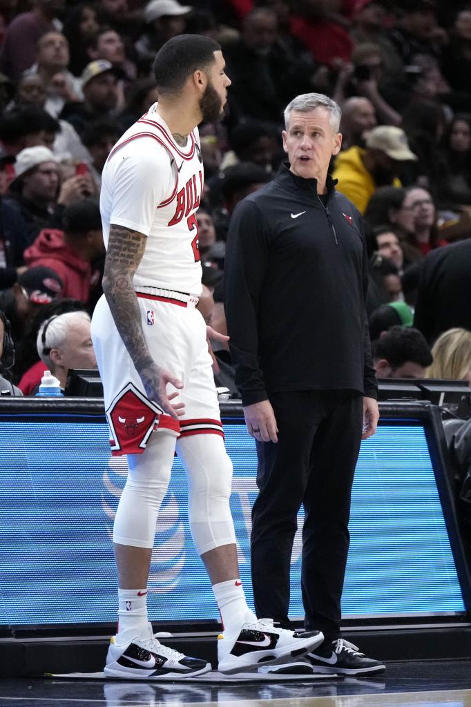 Billy Donovan talks to Lonzo Ball before giving him entry to the stadium.