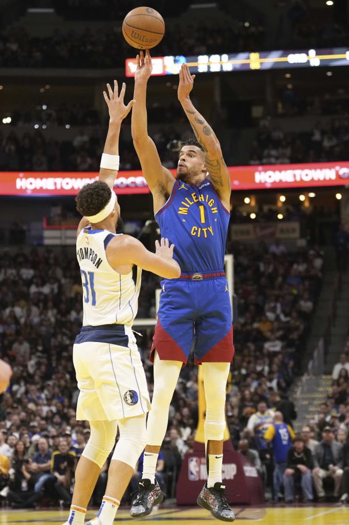 Clay Porter throws in front of Clay Thompson.