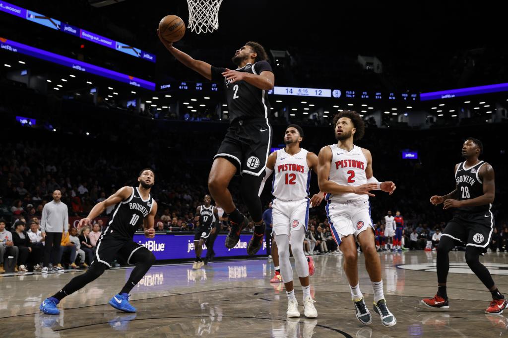 Cam Johnson tackles the basket against Tobias Harris and kid Cunningham.