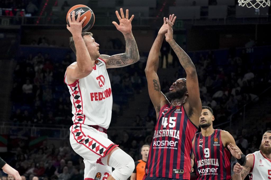 Donatas motegh ermenas shoots the basket defended by Donta Hall.