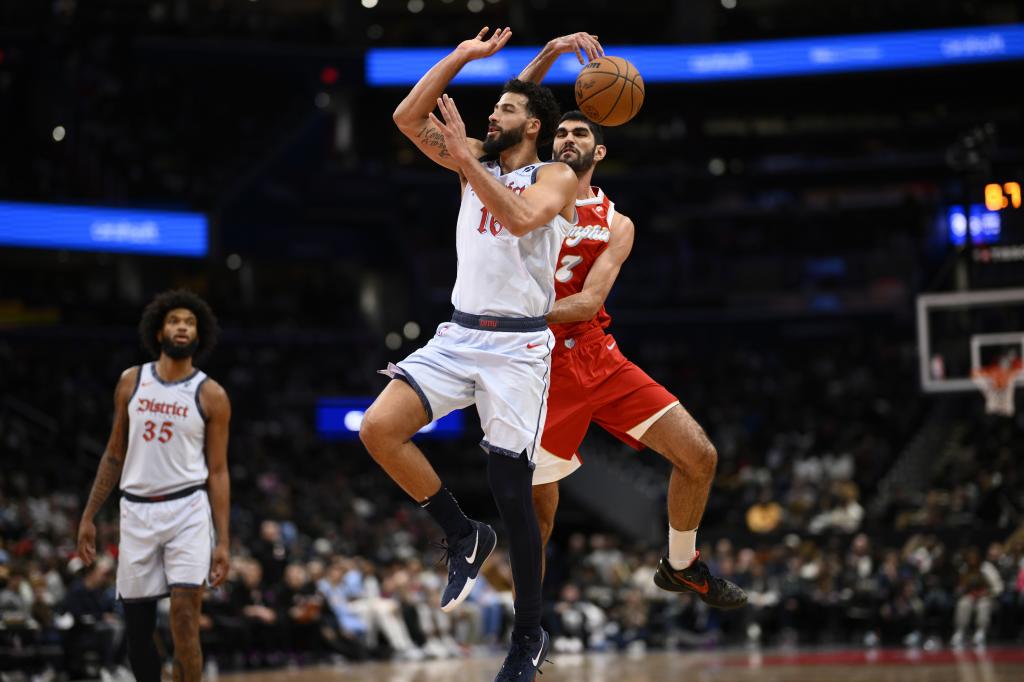 Memphis Grizzlies forward Santi checkers (7) takes a shot from Washington Wizards forward Anthony Gill (16) during the second half of an NBA basketball game, Sunday, Dec. 8, 2024, in Washington. (AP Photo / Nick Wass)