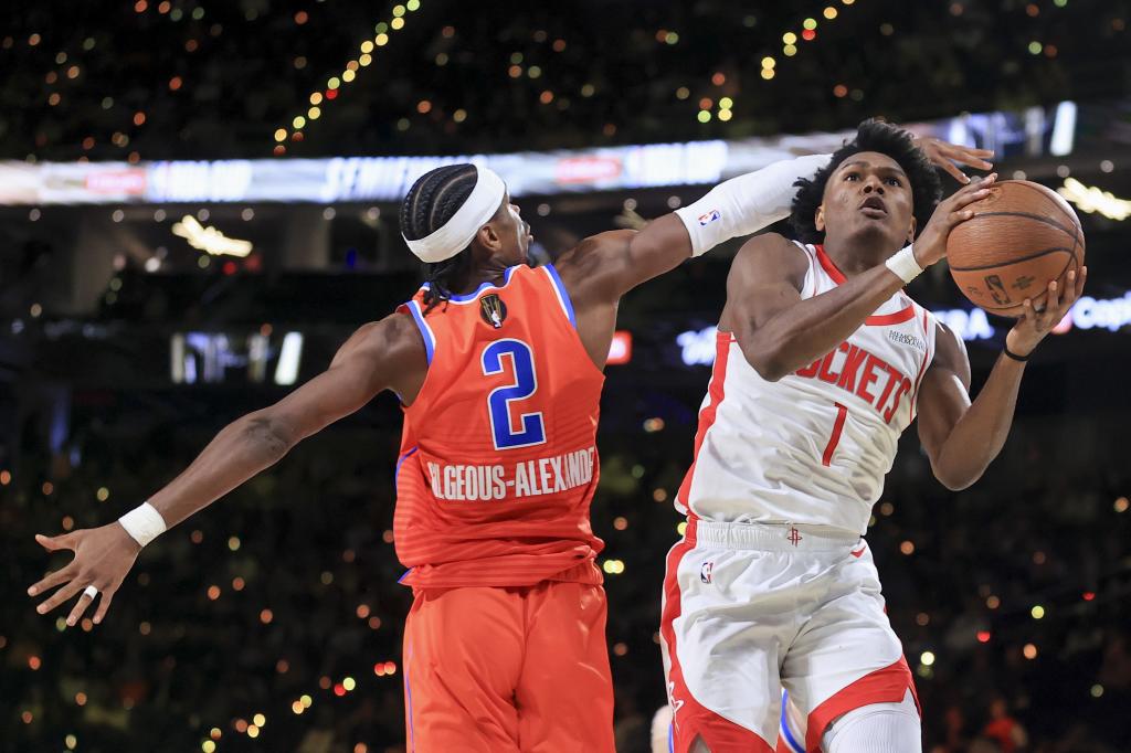 Houston Rockets forward Amen Thompson (1) looks to shoot against Oklahoma City Thunder guard Shay gilgius Alexander (2) during the second half of the NBA basketball Cup semifinal game Saturday, Dec. 14, 2024, in Las Vegas. (AP Photo / Ian Mulley)