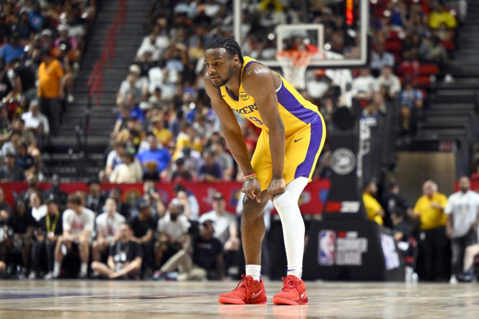 Bruni James takes a break at the Lakers ' Summer League game.