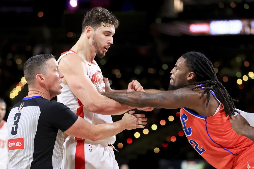 Oklahoma City Thunder guard Casson Wallace, right, pushes Houston Rockets center alberin sinjun, second from left, as referee Nick Buchert (3) moves during the second half of the NBA basketball Cup semifinal game Saturday, Dec. 14, 2024, in Las Vegas. (AP Photo / Ian Mulley)