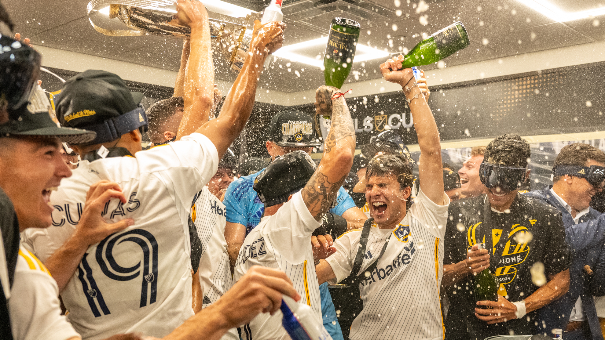 Ricky Puig celebrates his American Football League title in the locker room.